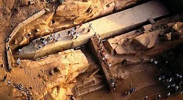 Overview of visitors walking around the Unfinished Obelisk quarry in Aswan